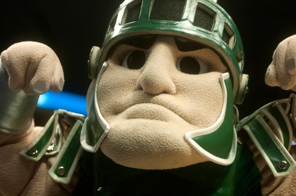 <p>Sparty flexes his muscles to the crowd on March 7, 2014 at Bankers Life Fieldhouse in Indianapolis during the game against Michigan. The Spartans won, 61-58, to advance to the third round of the Big Ten Tournament. Betsy Agosta/The State News</p>