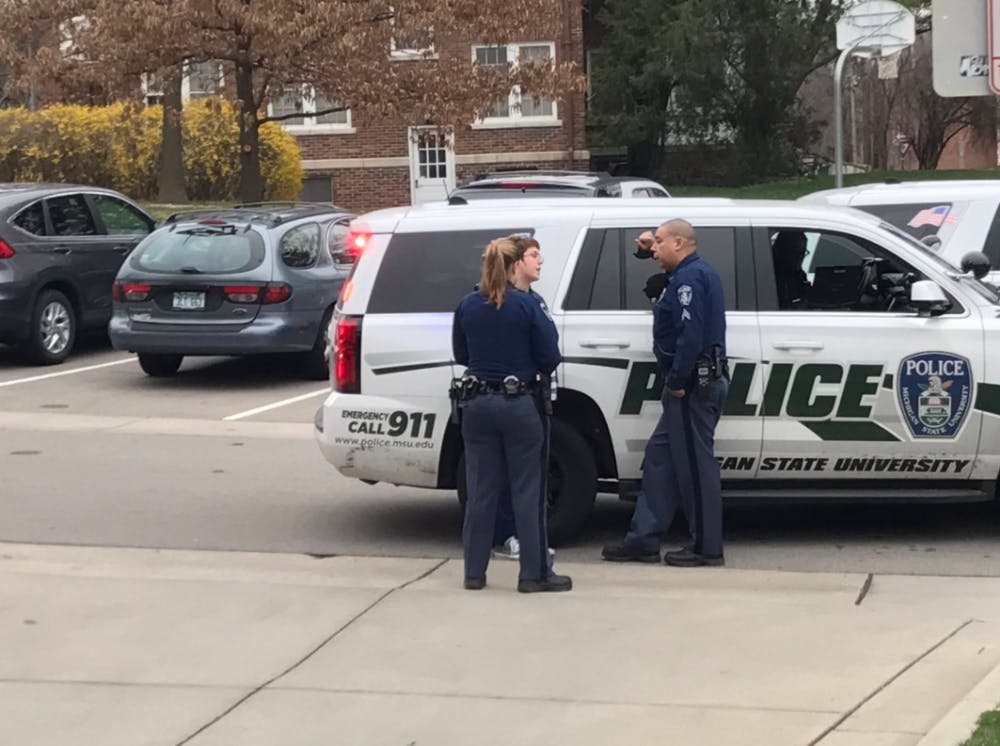 <p>MSU police respond to reports of a live weapon in West Circle Neighborhood near Williams Hall on April 13, 2017. Reports of a weapon were false and police found a cell phone was mistaken for the weapon.&nbsp;"What it looks like is her cell phone was on the dashboard and it’s in a black leather case, kind of big, and it was mistaken for a gun,” MSU Police Sgt. Michael Aguilera said. “No gun was involved. Everybody’s safe.”</p>
