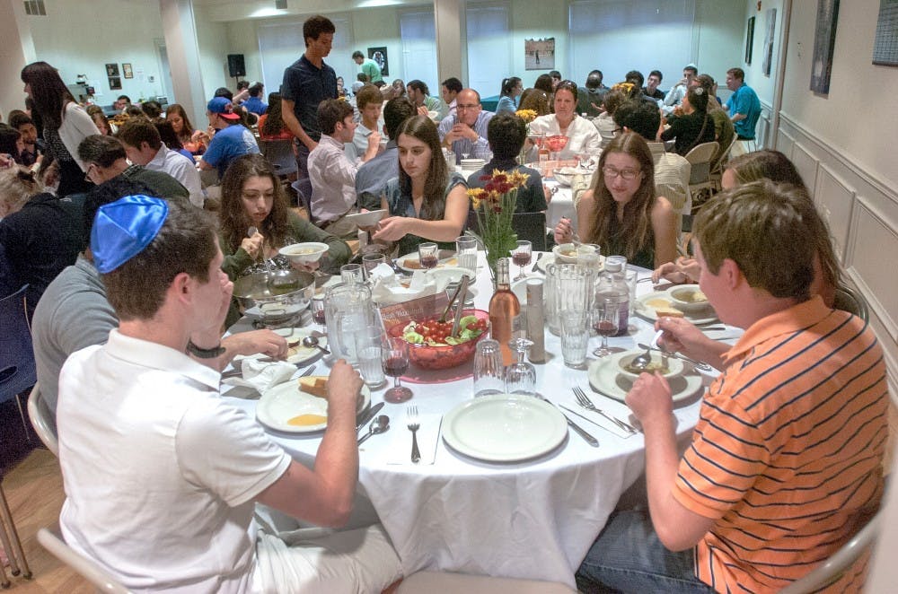 Members of the Jewish community celebrate the Jewish New Year, Rash Hashana, on Sunday, Sept. 16, 2012 at the Lester & Jewell Morris Hillel Jewish Center. The event included food and prayer to welcome in the New Year. James Ristau/The State News