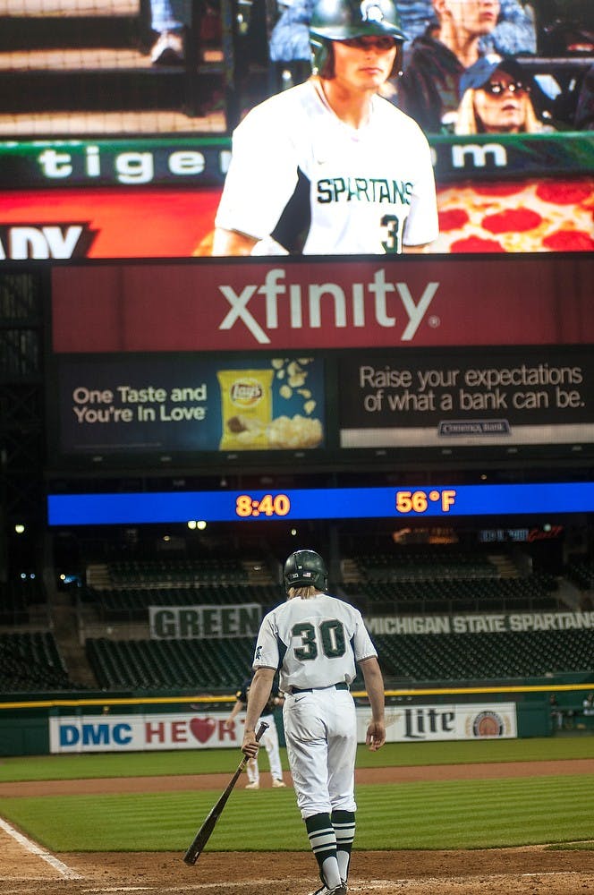 <p>Junior outfielder Cam Gibson stands at home plate preparing to bat April 14, 2015, during the game against Michigan at Comerica Park in Detroit. The Spartans defeated the Wolverines, 4-2. Allyson Telgenhof/The State News.</p>