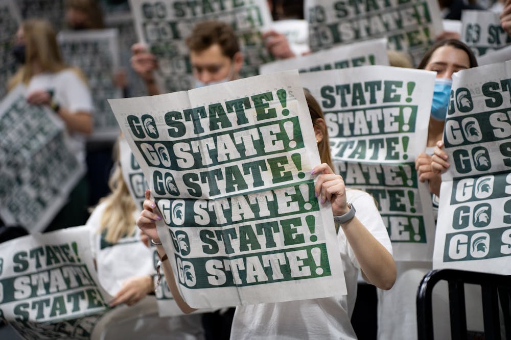 <p>Michigan State&#x27;s student section hold up newspapers that say &quot;Go State!&quot; as Northwestern&#x27;s starting lineup is announced on Jan. 15, 2022.</p>