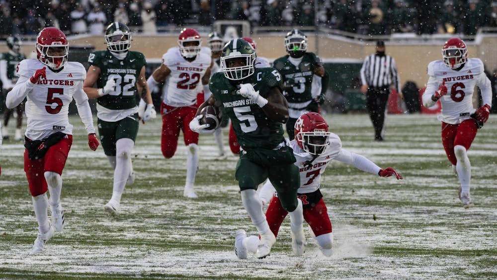 <p>MSU running back redshirt junior Nate Carter (5) runs past the Rutgers defense at Spartan Stadium on Nov. 30, 2024.</p>