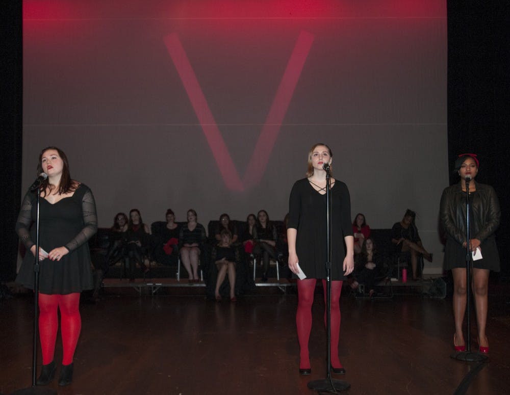 From left to right, advertising sophomore Pierce Wiselogle, social science junior Kate Huizinga and business freshman Camille Rogers perform a piece regarding a transgender experience during The Vagina Monologues final dress rehearsal on Jan. 26, 2017 at Wharton Center. The Vagina Monologues cast stand in solidarity with women from around the world in opposition to violence against women, tell real stories from women around the globe, and intend to empower and inform. The proceeds from this year's production will be going to the Michigan State University Sexual Assault Program.