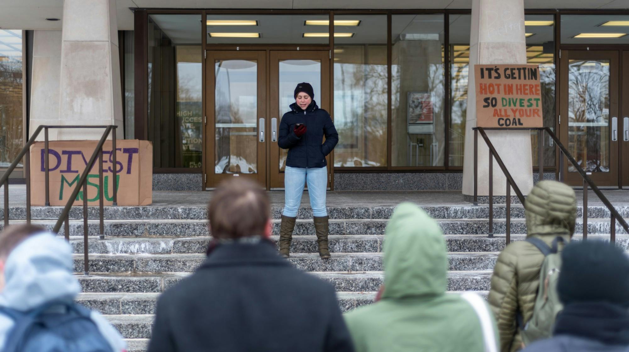 <p>A protestor speaks to an audience during a divestment day protest outside of the Hannah Administration Building on Feb. 14, 2020. </p>