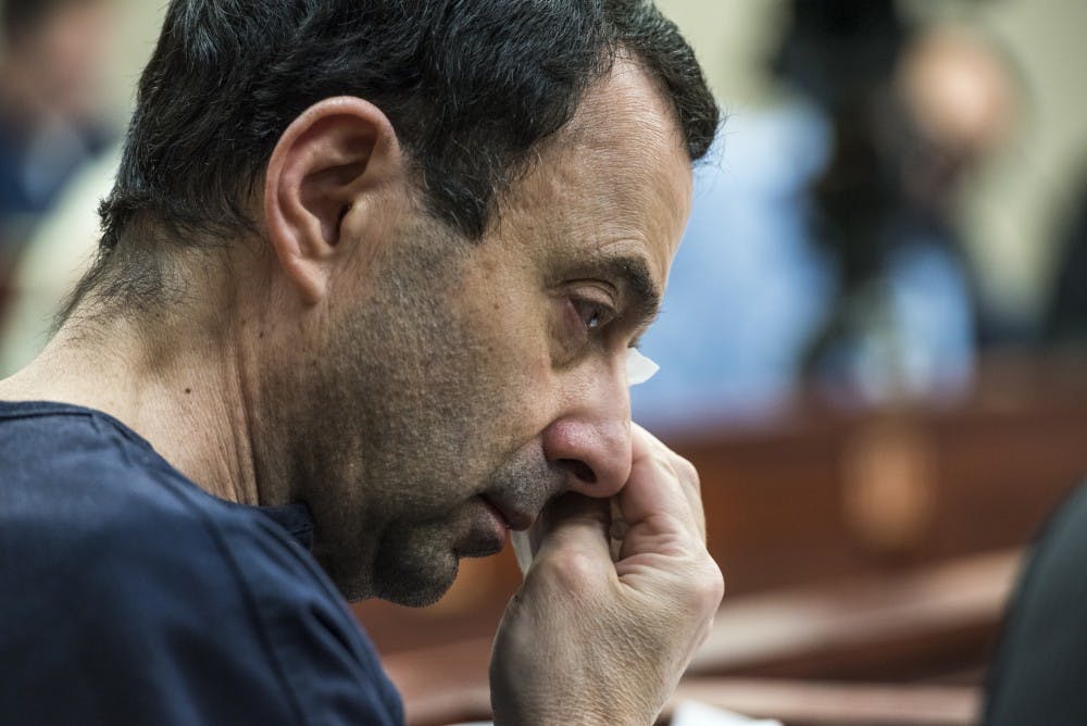 Ex-MSU and USA Gymnastics Dr. Larry Nassar wipes away tears during Christina Barba's statement on the sixth day of his sentencing on Jan. 23, 2018 at the Ingham County Circuit Court in Lansing. "I forgive you Larry," Barba said. "I will never hate you." (Nic Antaya | The State News)