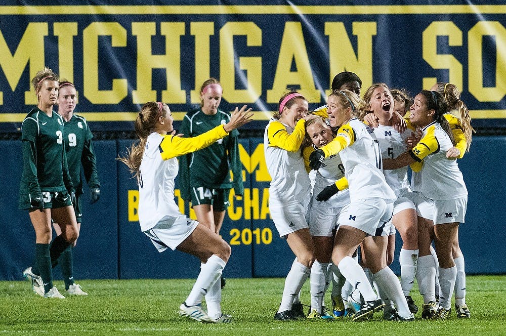 	<p>The Wolverines celebrate their win against the Spartans, 2-1, on Wednesday, Oct. 10, 2012 at the U-M Soccer Stadium. The game was forced into overtime. Julia Nagy/The State News</p>