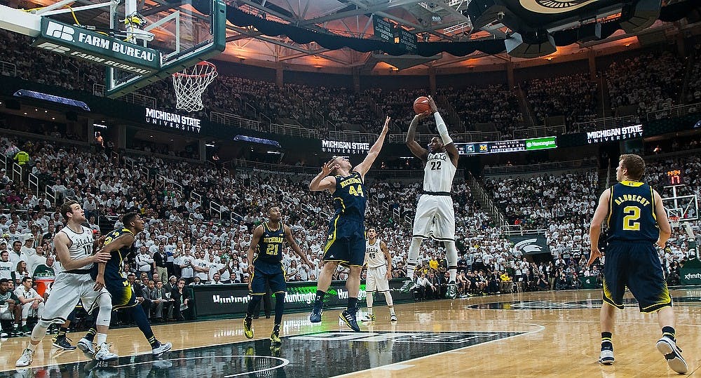 <p>Senior forward Branden Dawson shoots Feb. 2, 2015, during the game against Michigan at Breslin Center. The Spartans defeated the Wolverines in overtime, 76-66. Alice Kole/The State News</p>