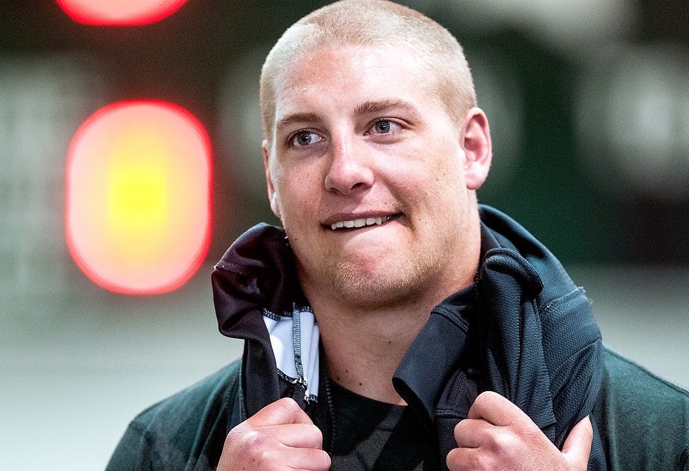 Junior linebacker Max Bullough watches as teammates perform drills for NFL scouts March 13, 2013, during Pro Day at the Duffy Daugherty Football Building. MSU football holds the annual event for NFL scouts and coaches to get a closer look at the Spartans' NFL prospects. Adam Toolin/The State News