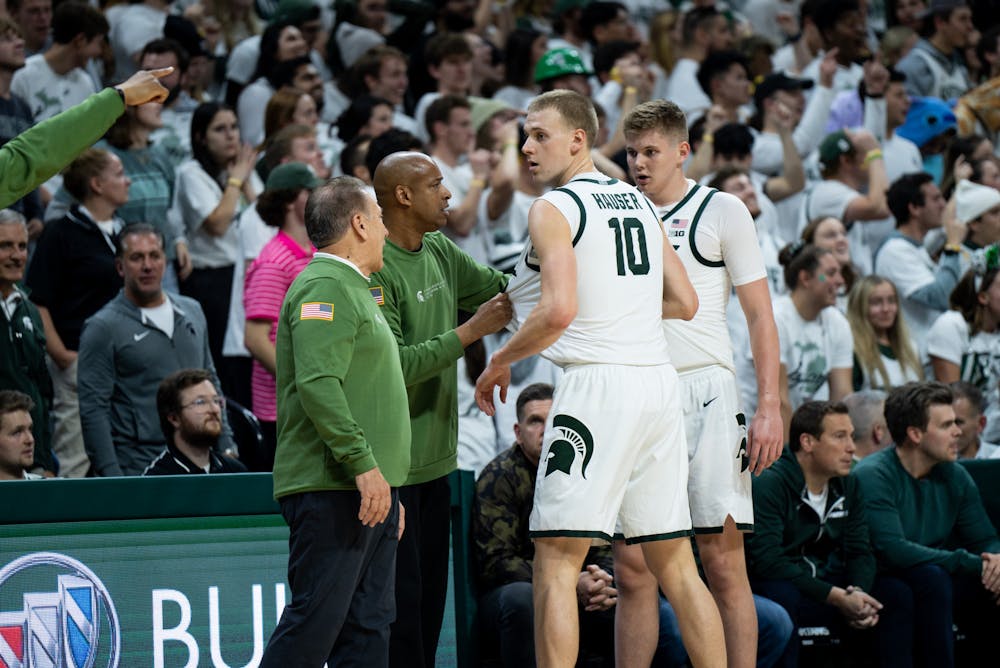 <p>Head Coach Tom Izzo and Assistant Coach Mark Montgomery advise of play to graduate student forward Joey Hauser (10) and freshman forward Jaxon Kohler (0) during a game against Villanova at the Breslin Center on Nov. 18, 2022. The Spartans defeated the Wildcats 73-71. </p>