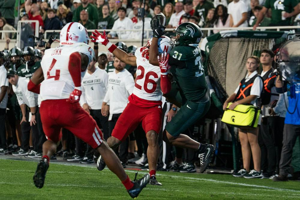 <p>Michigan State freshman tight end Jayden Savoury (31) catches a pass over Nebraska fifth-year defensive back Dwayne McDougle III during the Spartans’ game against Nebraska at Spartan Stadium in East Lansing, Mich., on Saturday, Sept. 26, 2026.</p>