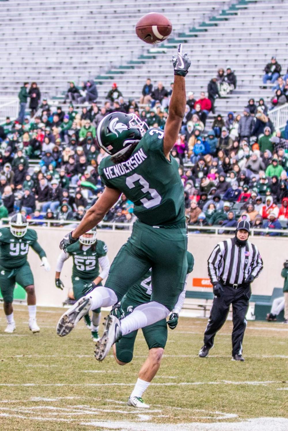 Freshman safety Xavier Henderson (3) tips a pass during the annual Green and White spring game on April 7, 2018 at Spartan Stadium. White defeated Green, 32-30.