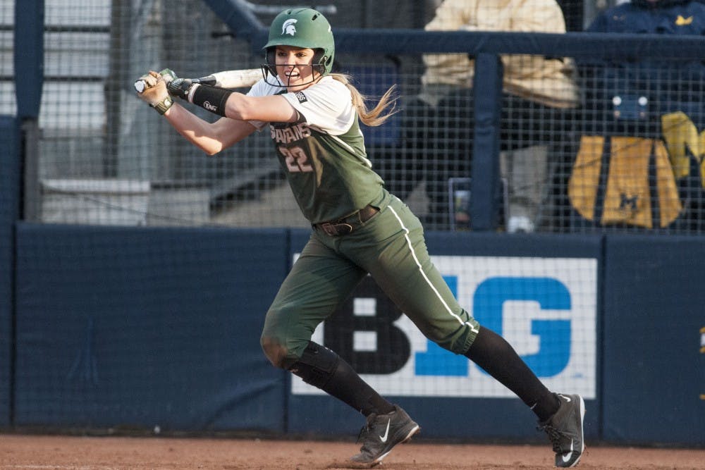 <p>Junior second baseman McKenzie Long (22) swings the bat during the game against University of Michigan on April 18, 2017 at Wilpon Baseball and Softball Complex in Ann Arbor. The Spartans were defeated by the Wolverines, 3-1. &nbsp;</p>