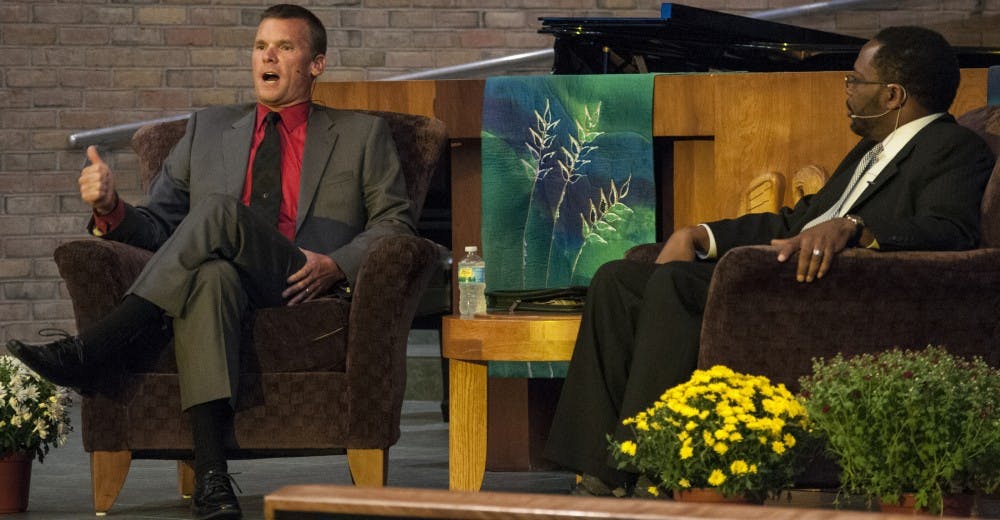 Scott Wriggelsworth, left, addresses the audience during the International Day of Peace on Sept. 22, 2016 at the University United Methodist Church.  Wriggelsworth is a local policeman who defended the efforts of his department as well as all others. 