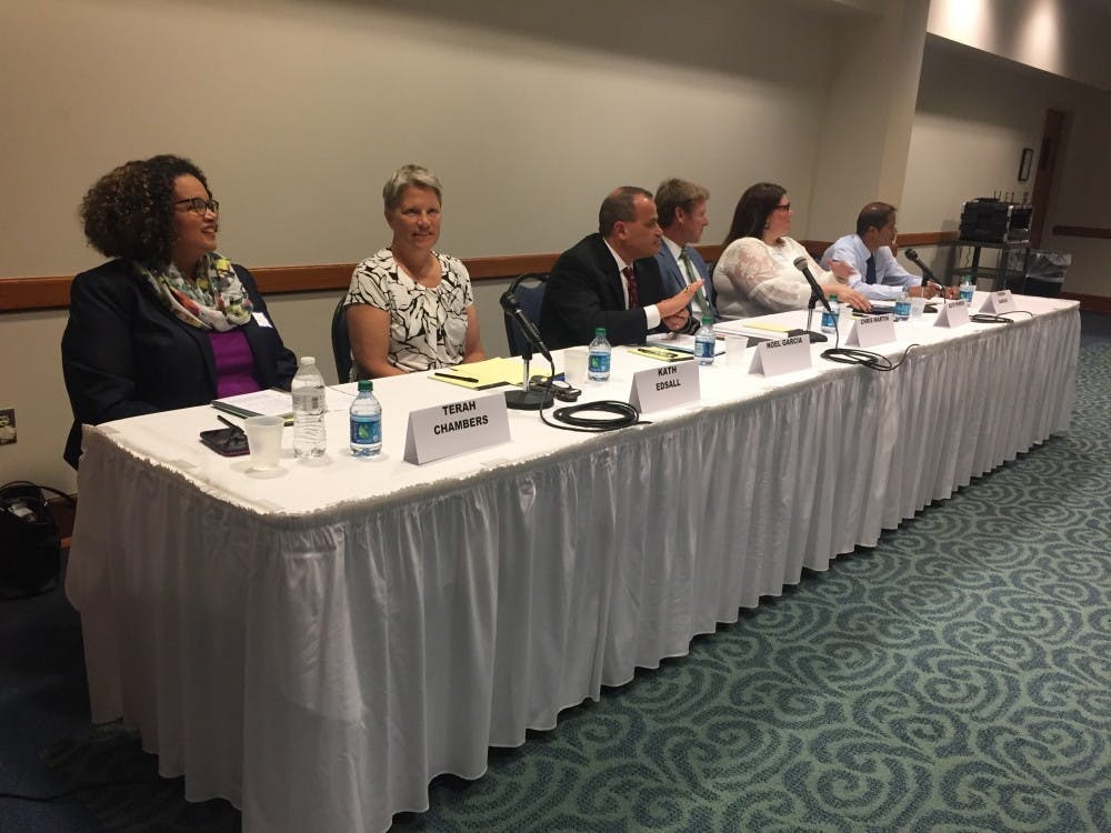 The six candidates for four open seats on the East Lansing Board of Education sit at a forum held by the League of Women Voters on Sept. 26. S.F. McGlone/The State News