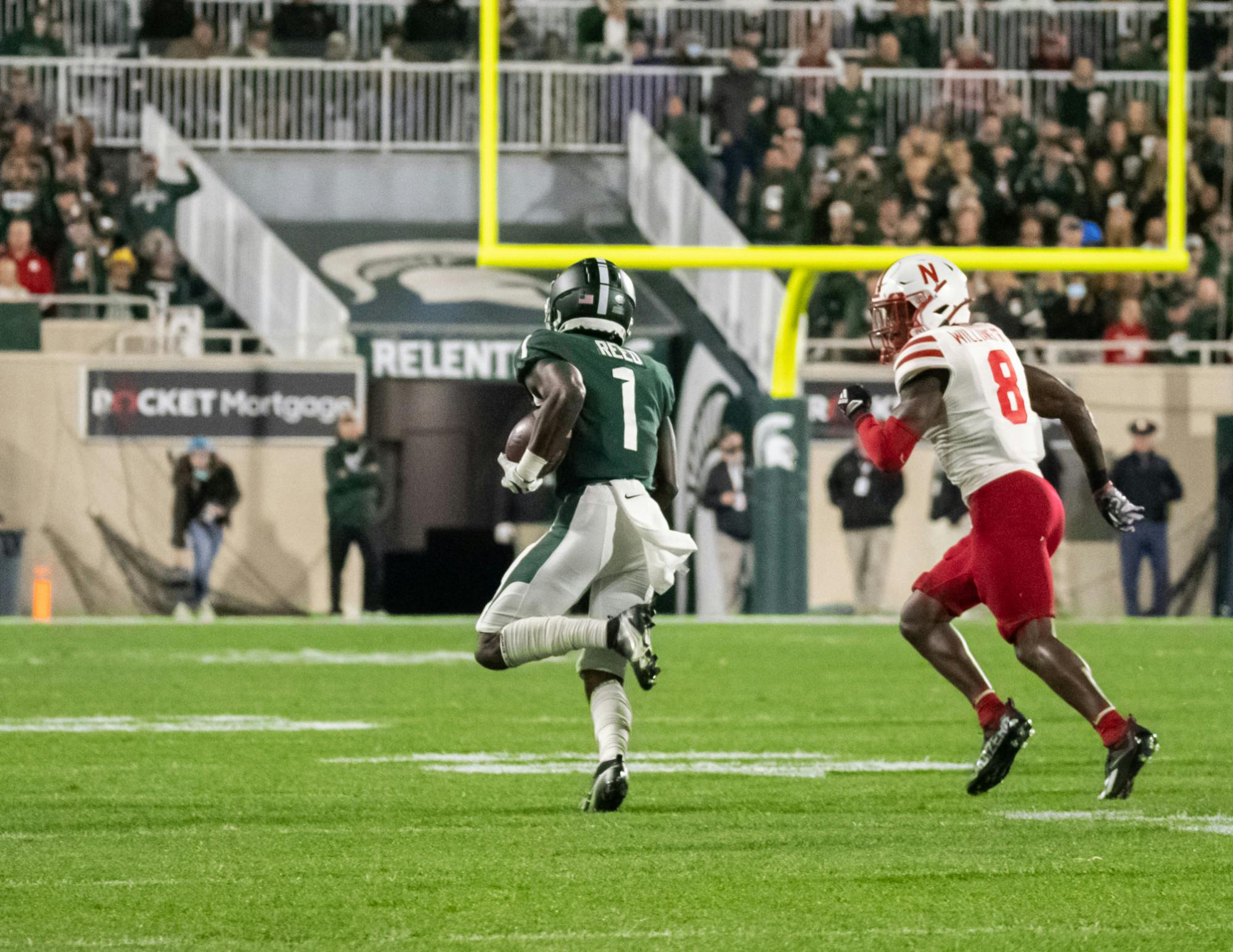 <p>Michigan State&#x27;s redshirt junior wide receiver Jayden Reed (1) runs the ball towards the endzone on Sept. 25, 2021.</p>