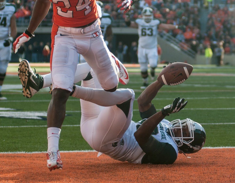 	<p>Senior wide receiver Bennie Fowler falls into the end zone for a touchdown during the game against Illinois at Urbana Champaign, Saturday, Oct. 26, 2013, at Memorial Stadium in Champaign, Ill. The Spartans lead 14-3 at halftime. Danyelle Morrow/The State News</p>