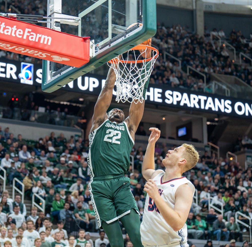 <p>Senior center Mady Sissoko (22) dunks the ball during a game against Southern Indiana at the Breslin Center on Nov. 9, 2023. The Spartans defeated the Screaming Eagles 74-51.</p>