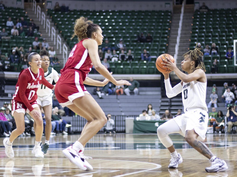 Michigan State University junior guard DeeDee Hagermann (0) looks to see who is open during a game against Nebraska at the Breslin Center on Dec. 9, 2023.