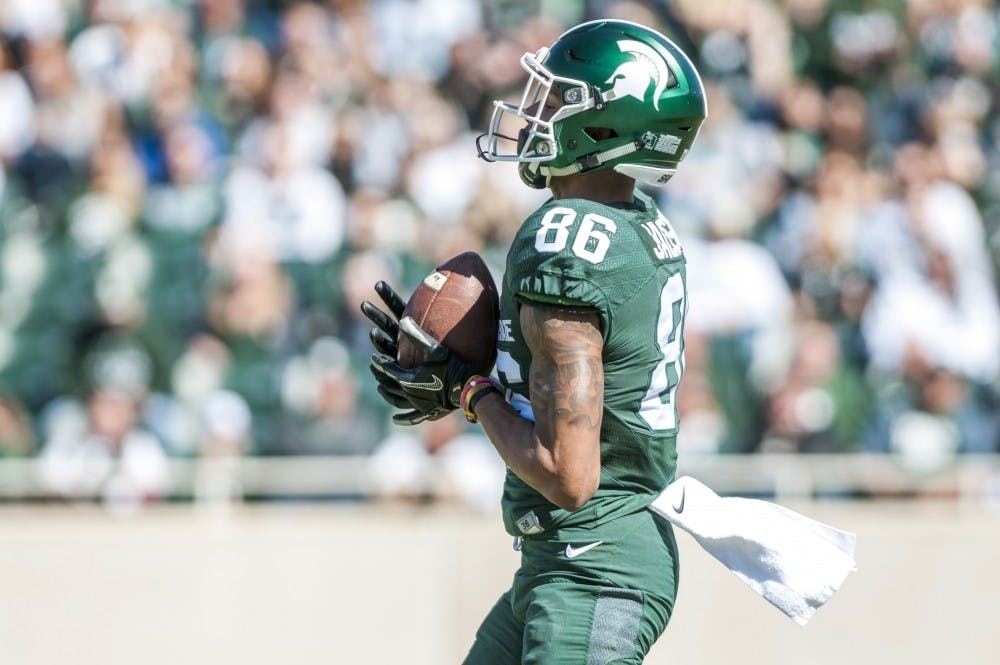 <p>Sophomore wide receiver Trishton Jackson (86) catches the ball during a kick off in the Green and White Spring Game on April 1, 2017 at Spartan Stadium. The White team defeated the Green team, 33-23.</p>