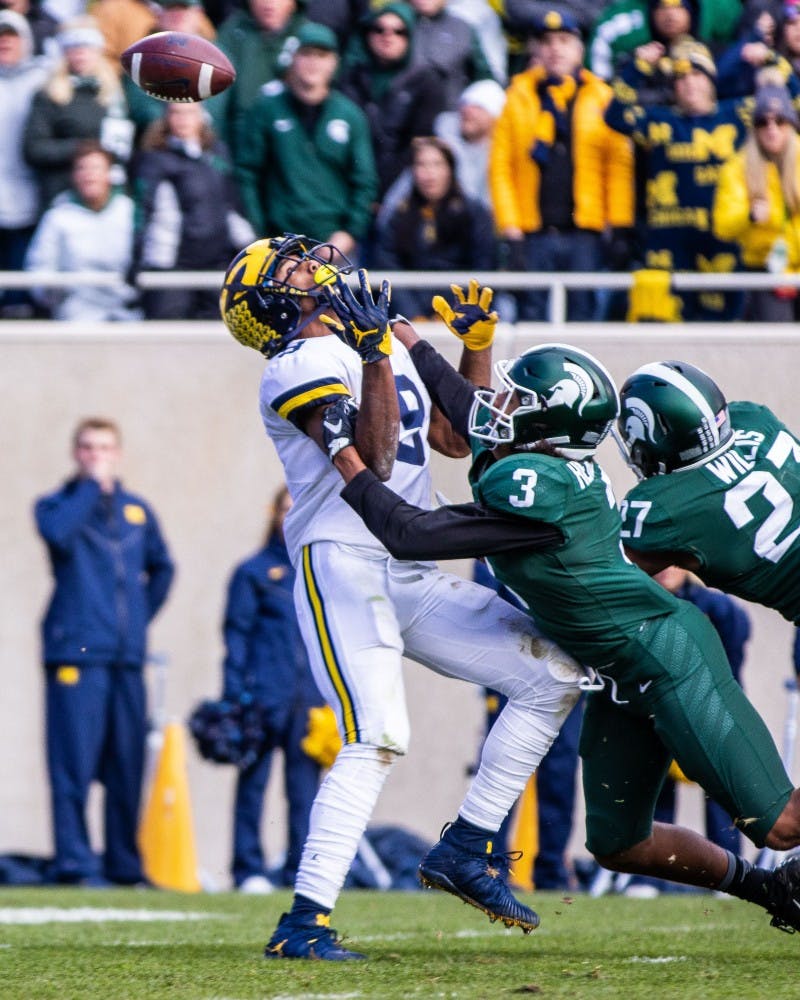 <p>Then-freshman safety Xavier Henderson (3) defends a pass to Michigan receiver Donovan Peoples-Jones (9) during the game at Spartan Stadium on Oct. 20, 2018. The Wolverines defeated the Spartans, 21-7.</p>
