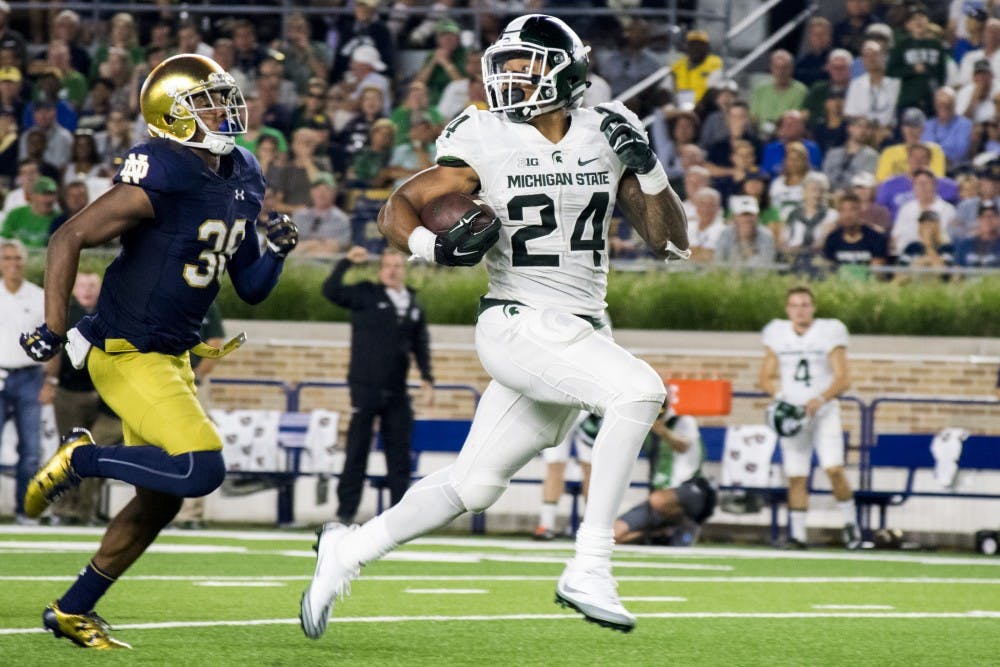 Senior running back Gerald Holmes (24) runs for a touchdown during the game against Notre Dame on Sept. 17, 2016 at Notre Dame Stadium in South Bend, Ind.  The Spartans defeated the Fighting Irish, 36-28.