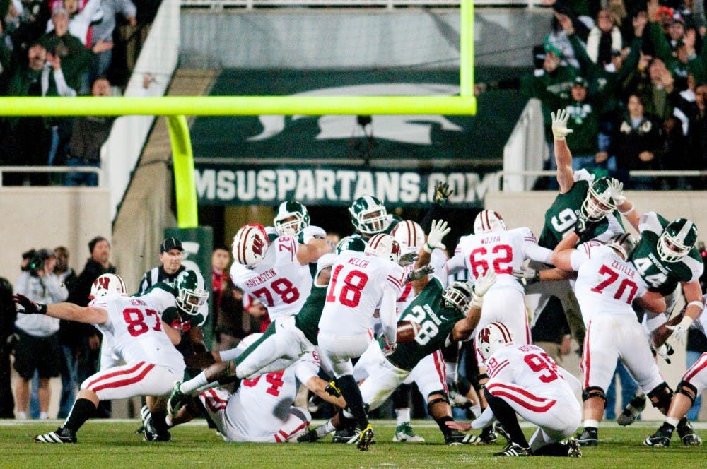 The defense blocks a field goal attempt by Wisconsin in the first half. The Spartans defeated Wisconsin, 37-31, on Saturday night at Spartan Stadium. Josh Radtke/The State News