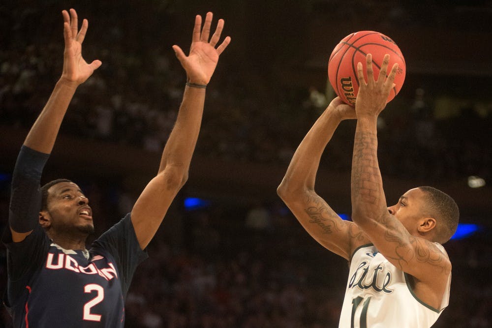 <p>Senior guard Keith Appling goes up to the basket as Connecticut forward DeAndre Daniels guards March 30, 2014, at Madison Square Garden in New York City. The Spartans lost in the Elite Eight, 60-54. Julia Nagy/The State News</p>