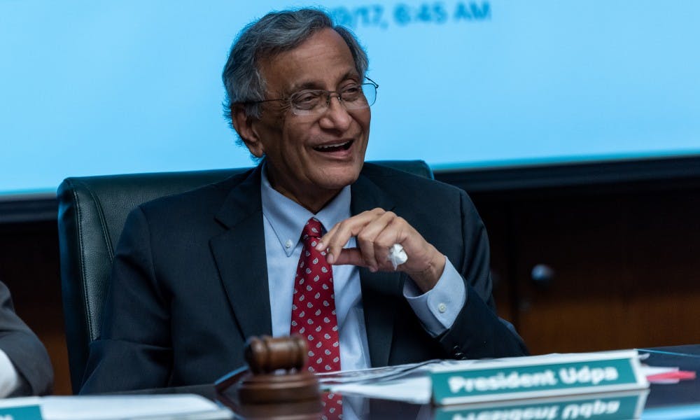 <p>Satish Udpa smiles during his final Board of Trustees meeting on June 21, 2019 at the Hannah Administration Building.</p>