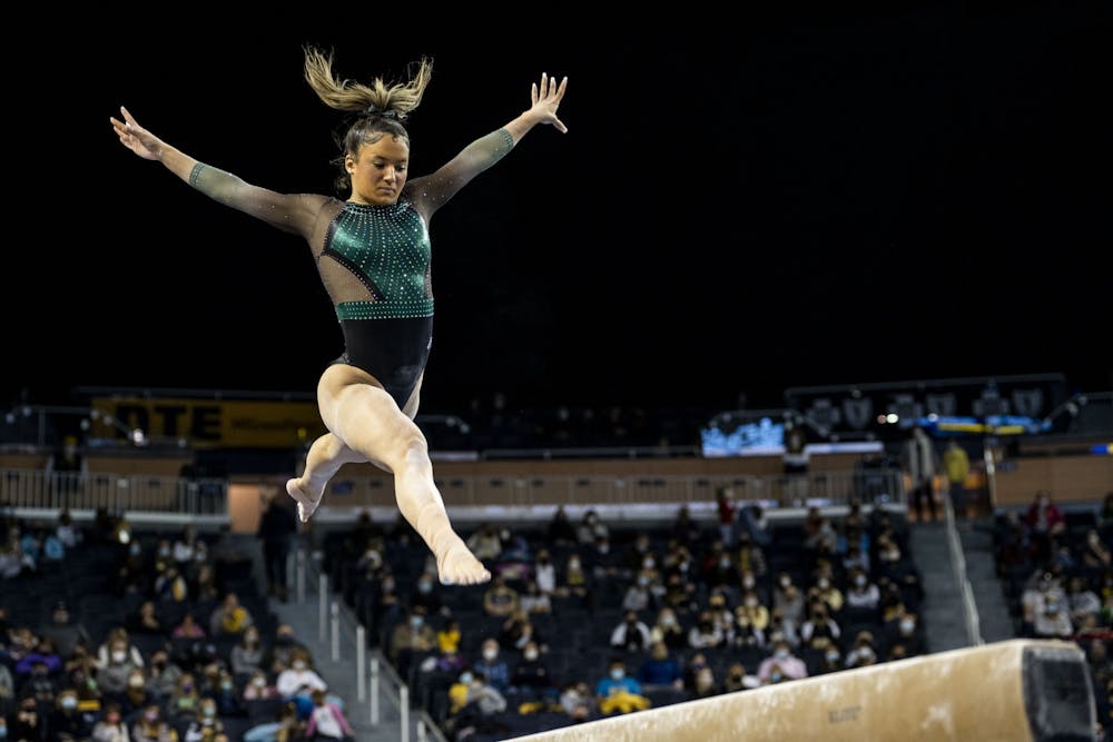 All-around freshman Skyla Schulte on the balance beam at the meet against Michigan on January 30, 2022, at the Crisler Center in Ann Arbor. The Spartans lost to the Wolverines 197.925 to 196.775.