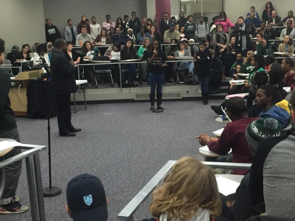 <p>International relations senior&nbsp;Florence Otaigbe addresses&nbsp;Assistant Vice President for Identity and Affinity Dr. Terrance Frazier at an open forum to discuss student concerns about campus racism on Friday.&nbsp;</p>