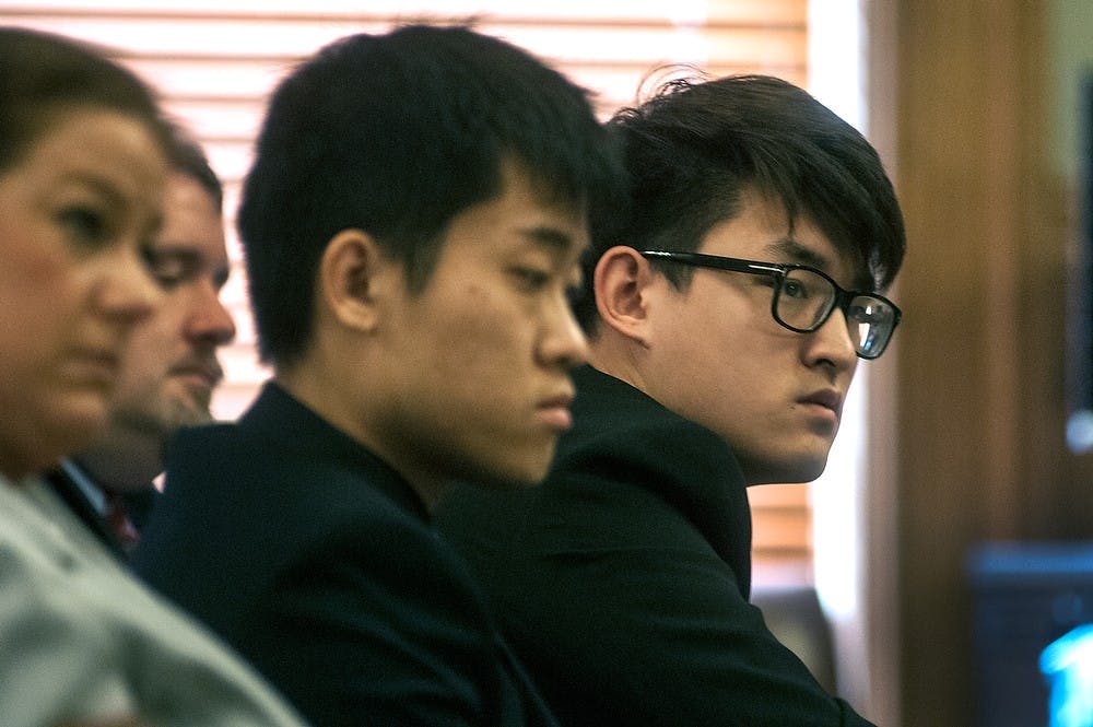 <p>MSU alumnus Meng Long Li and MSU student Shan Gao sit with their attorneys Roberta Sacharski and Patrick Crowley while they listen to attorney Chris Bergstrom's closing statements Feb. 2, 2015, at 30th Circuit Court in the Ingham County Courthouse, 315 S. Jefferson St., Mason, Michigan. Bergstrom urged the jurors to see the lack of evidence and motive in the case and reiterated that the assault was not gang-related. Allyson Telgenhof/The State News.</p>