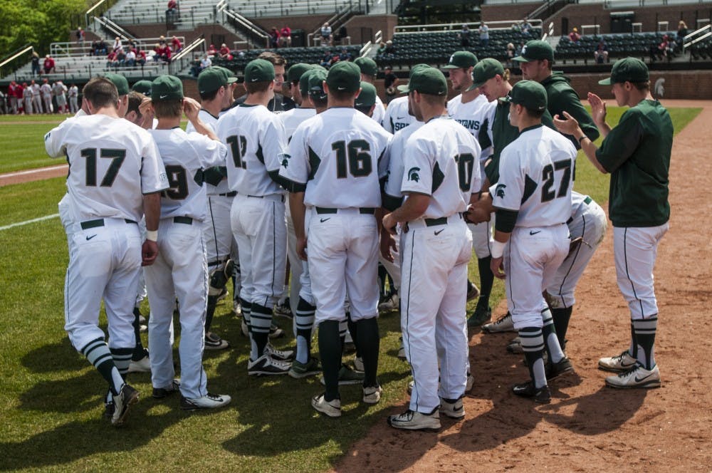 The Spartans huddle together before the game against Nebraska on May 9, 2016 at McLane Stadium. The Spartans were defeated by the Cornhuskers, 7-4.