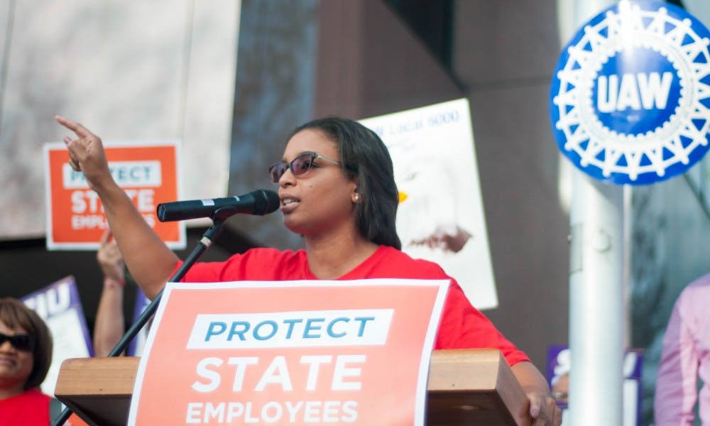 Flint resident and UAW 6000 member Marseille Allen speaks during a protest of state workers' bargaining rights on Sep. 20, 2017 outside the Capitol Commons Center in Lansing. When news of the Flint water crisis broke, Allen decided to remain in Flint to help those directly affected.