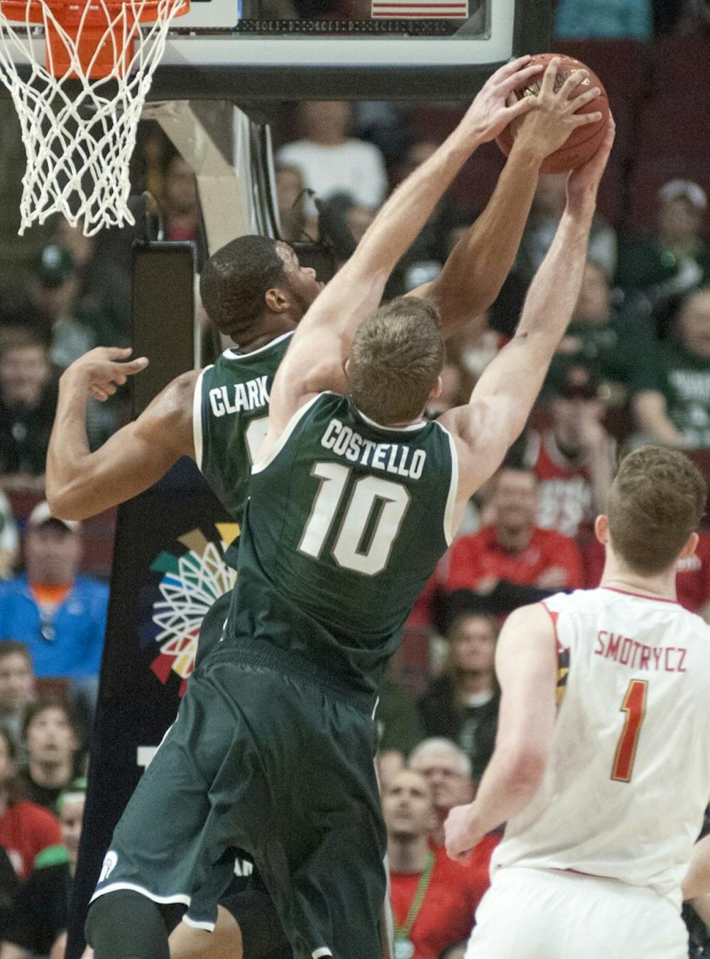 <p>Freshman forward Marvin Clark Jr. and junior forward Matt Costello jump for a rebound Mar. 14, 2015, during the game against Maryland at the Big Ten Tournament at United Center in Chicago. The Spartans defeated the Terrapins, 62-58. Kelsey Feldpausch/The State News</p>