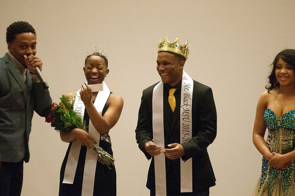<p>Arts and humanities and pre-med junior Champagne Smith and advertising and food management  junior Day' Shawn Lyons accept their awarded titles April 10, 2015, at the conclusion of the Black Student Alliance Mr. and Mrs. Black MSU scholarship pageant at the Kellogg Center. The event was in accordance with the 50 Shades of Excellence campaigns. Kennedy Thatch/The State News</p>