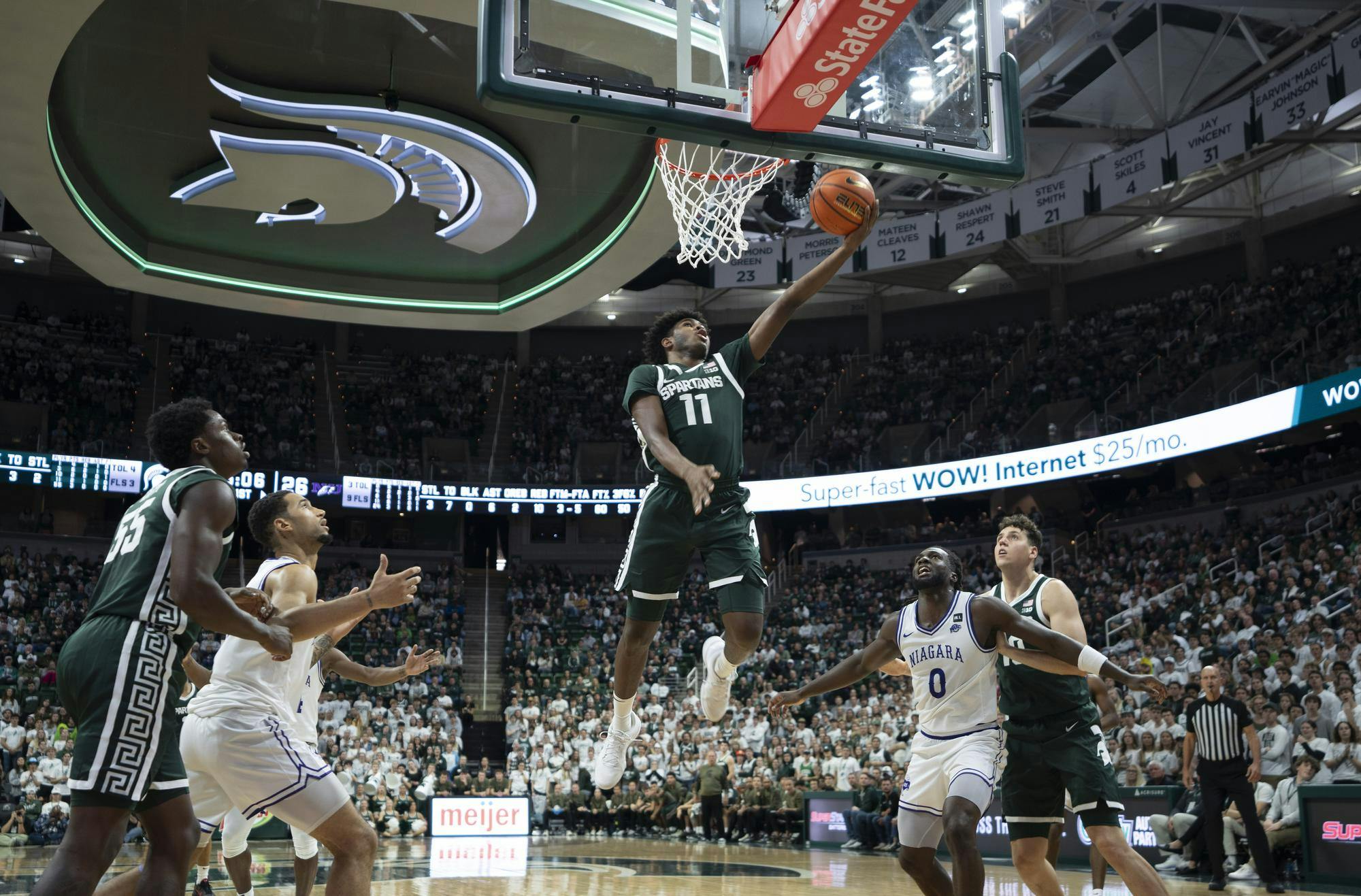 MSU freshman guard Jase Richardson (11) scores during the MSU vs. Niagara basketball match at Breslin Center on Nov. 7, 2024.