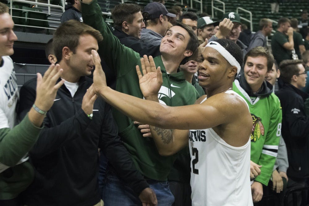 Freshman forward Miles Bridges (22) high-fives fans after the basketball game against Northwood on Oct. 27, 2016 at Breslin Center. The Spartans defeated the Timberwolves, 93-69. 