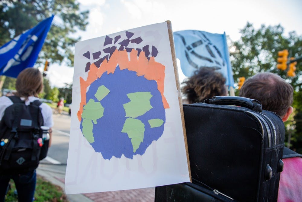 <p>The East Lansing Extinction Rebellion group held a rally calling for action on climate change on Sept. 23, 2019 on Grand River Avenue.</p>