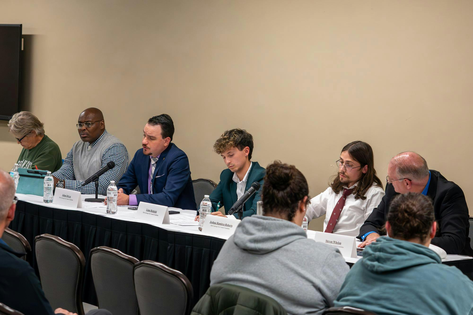City council candidates prepare for the start of ASMSU’s City Council Candidate Panel at the MSU Union in East Lansing, Mich., on Oct. 22, 2025.