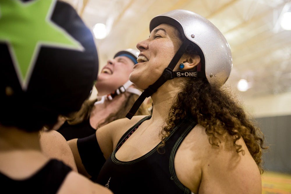  "Hit's and Giggles" chants with her team after the 2019 home opener game against Akron on Feb. 9, 2019 at Aim High Sports in Dimondale, MI. The Vixens fell to Akron, 175-74.