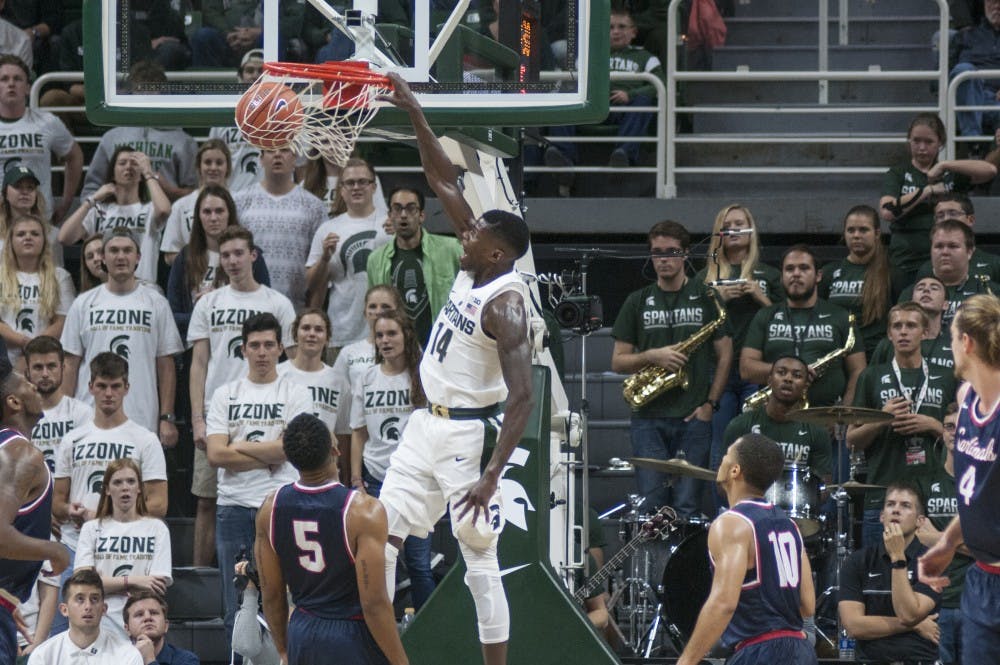 Redshirt senior guard Eron Harris (14) dunks the ball during the first half of the game against Saginaw Valley State University on Nov. 2, 2016 at the Breslin Center. 