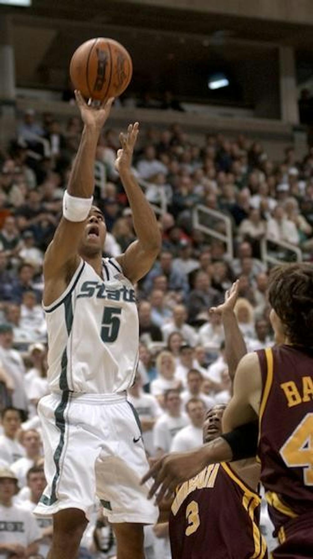 Sophomore guard Chris Hill keeps an eye on the basket as he takes a shot Wednesday night at Breslin Center.  MSU beat the Golden Golphers 71-61.Jason Fiedler/The State News