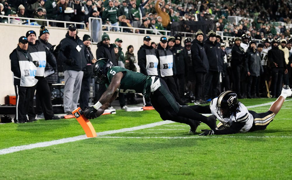 <p>MSU junior running back Nate Carter (5) catches a ball in the end zone for a touchdown against Purdue at Spartan Stadium on Nov. 22, 2024.</p>