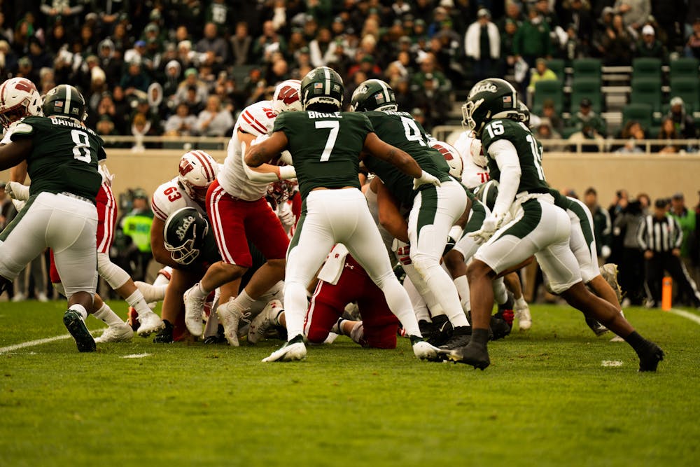 <p>MSU and Wisconsin during a play, at the MSU vs. Wisconsin game held at the Spartan Stadium on October 15, 2022. The Spartans beat the Badgers 34-28.</p>