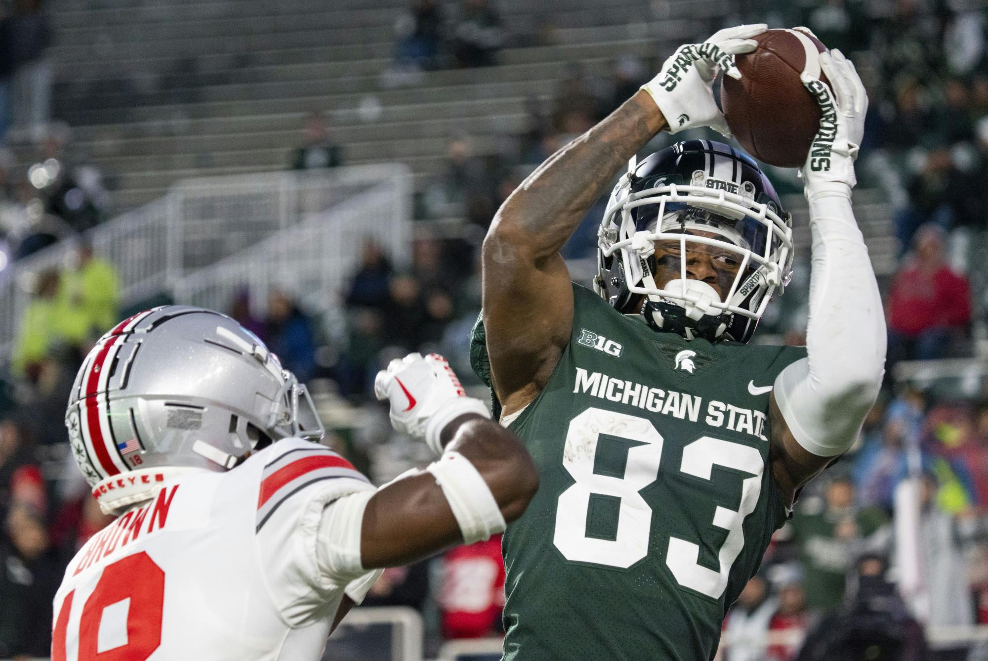 <p>Junior wide receiver Montorie Foster Jr., 83, catches the ball for a Spartan touchdown during Michigan State’s game against Ohio State on Saturday, Oct. 8, 2022 at Spartan Stadium. The Buckeyes ultimately beat the Spartans, 49-20.</p>