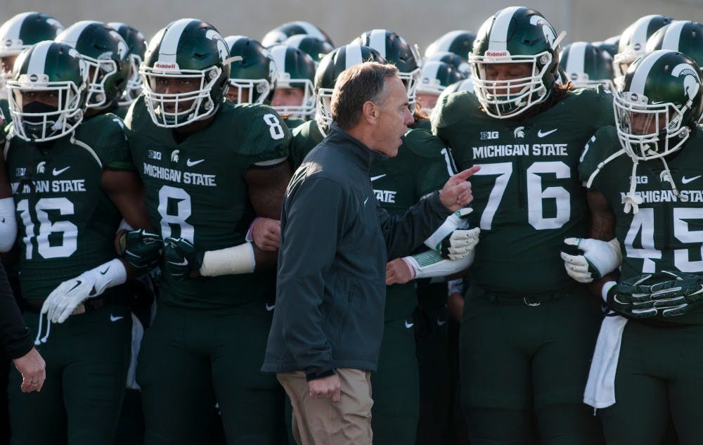 Head coach Mark Dantonio speaks to his team prior to the game against Penn State on Nov. 28, 2015 at Spartan Stadium. The Spartans defeated the Nittany Lions, 55-16.