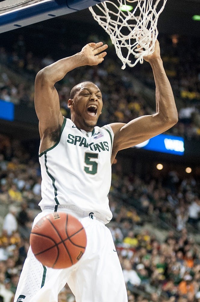 	<p>Junior center Adreian Payne reacts after dunking the basket in the first half. The Spartans leads the Tigers during halftime, 32-29, Saturday, March 23, 2013, at The Palace of Auburn Hills in Auburn Hills, Mich. Justin Wan/The State News</p>