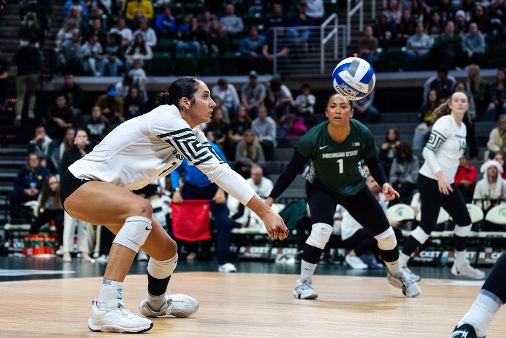 Michigan State junior outside hitter Taylor Preston (7) attacks the ball against the University of Michigan at the Breslin Center on Nov. 15, 2024.