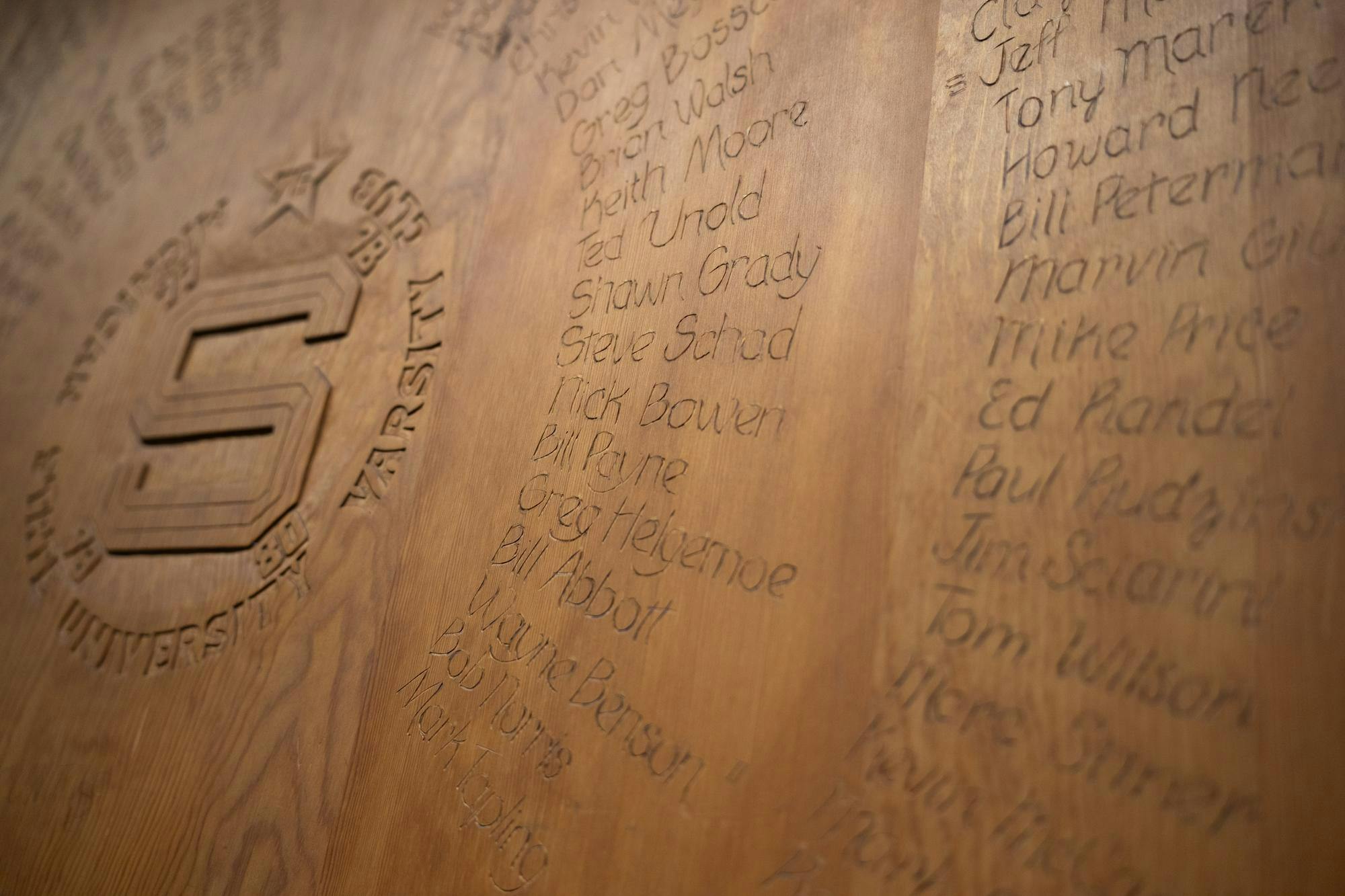 Michigan State varsity letter winners used to have a tradition of carving their names into special wooden tables in the Student Union. The tables were restored in 2007 and put on display in the Spartan Stadium club room said its director, Kate Souder.