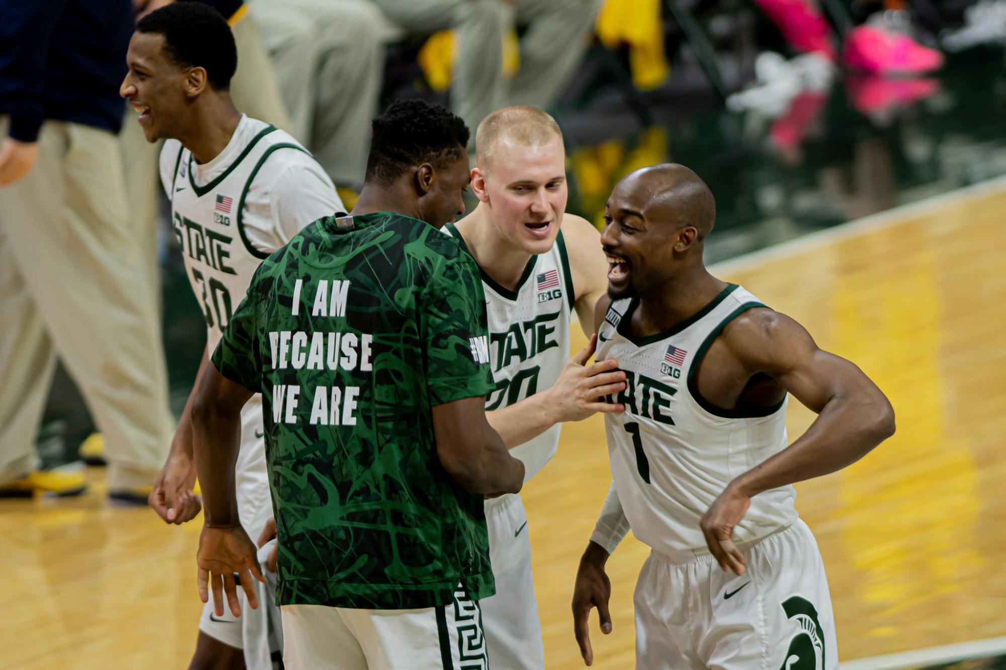 <p>Redshirt senior guard Joshua Langford (1) celebrates with freshman forward Mady Sissoko and junior forward Joey Hauser after the Spartans&#x27; upset of No. 2 Michigan on March 7, 2021. A Langford three-pointer iced the game.</p>
